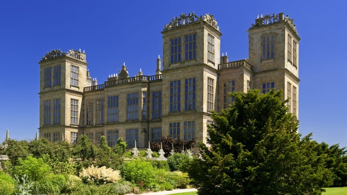 A view of Hardwick Hall with the south border in full bloom in front of the building